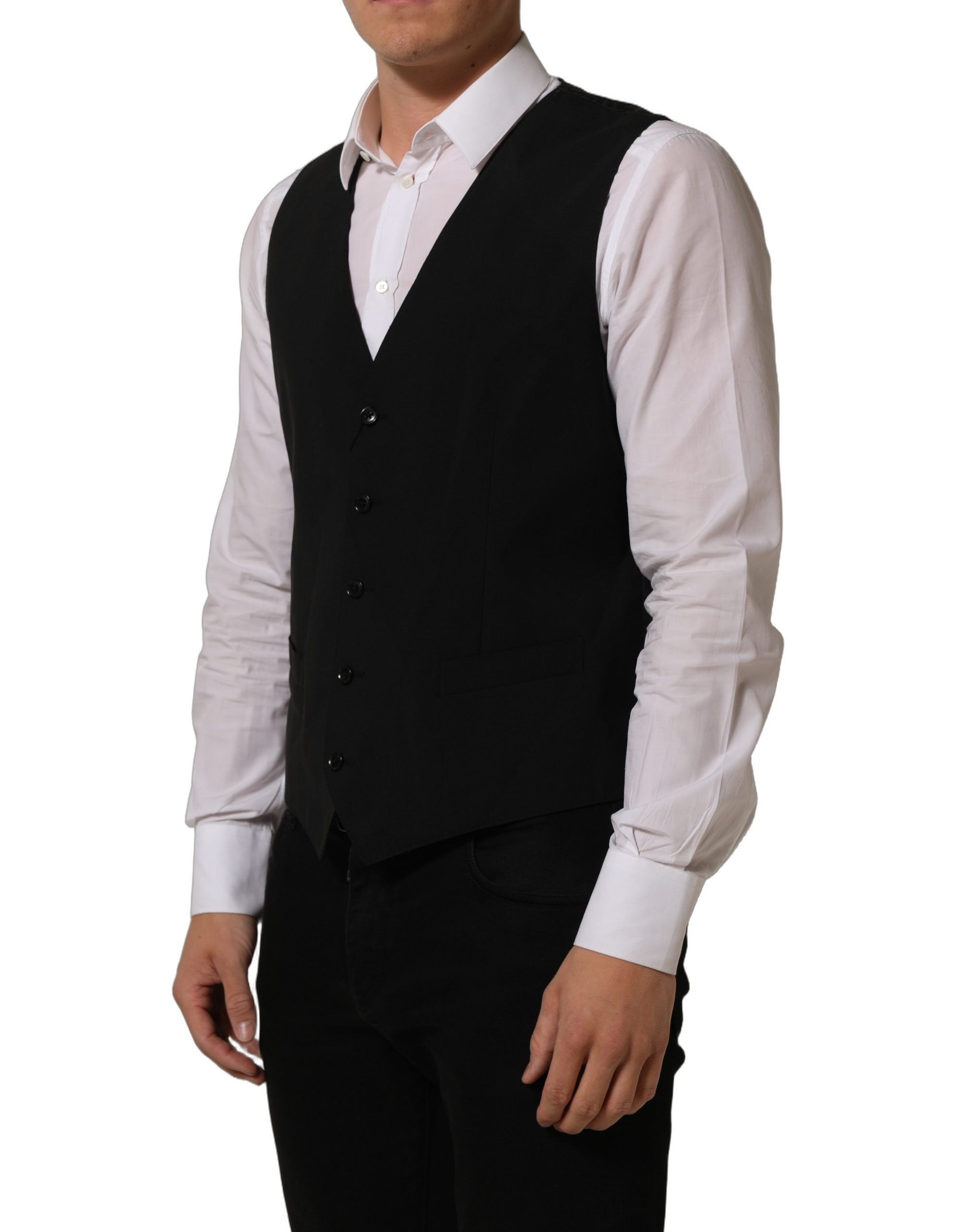 Gilet formel en laine noire Dolce & Gabbana avec taille extensible, porté comme vêtement élégant et sophistiqué.