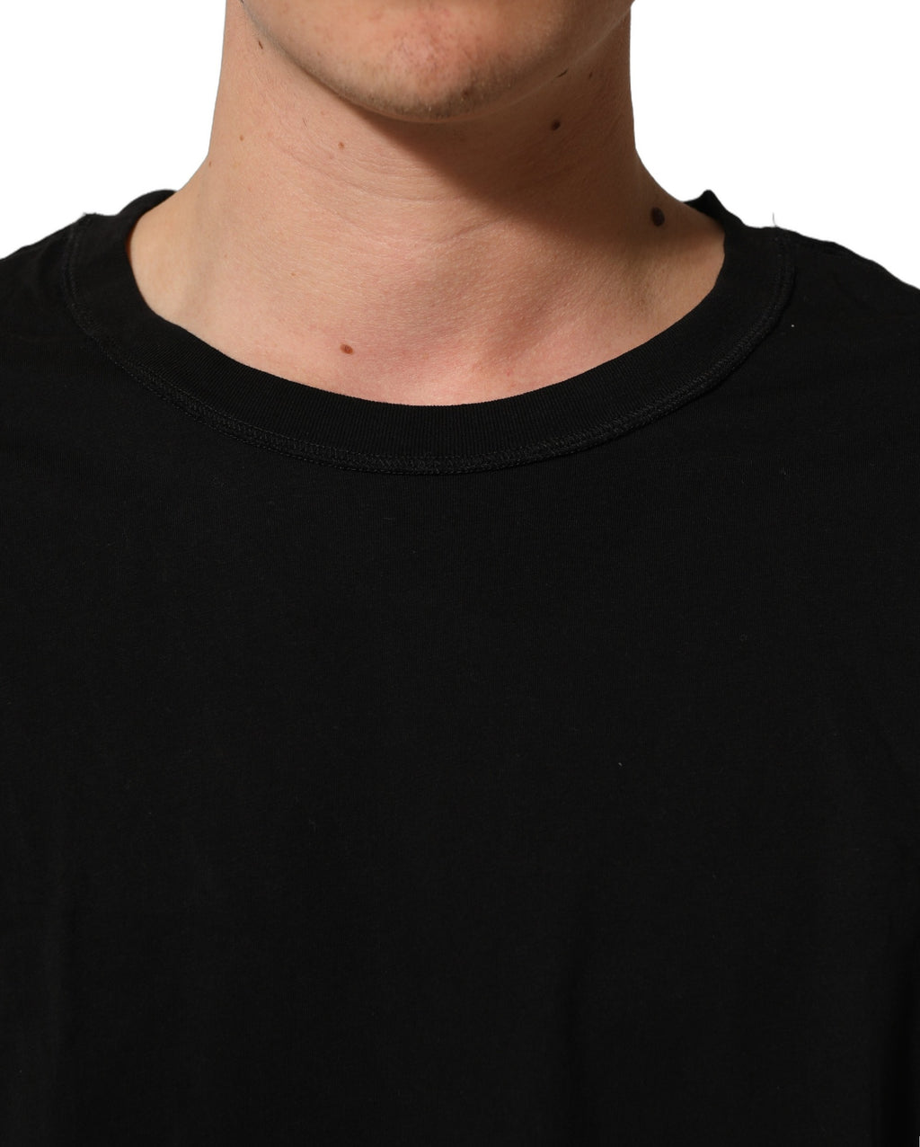 T-shirt noir en coton à manches courtes et col rond de Dolce & Gabbana, vue de face.