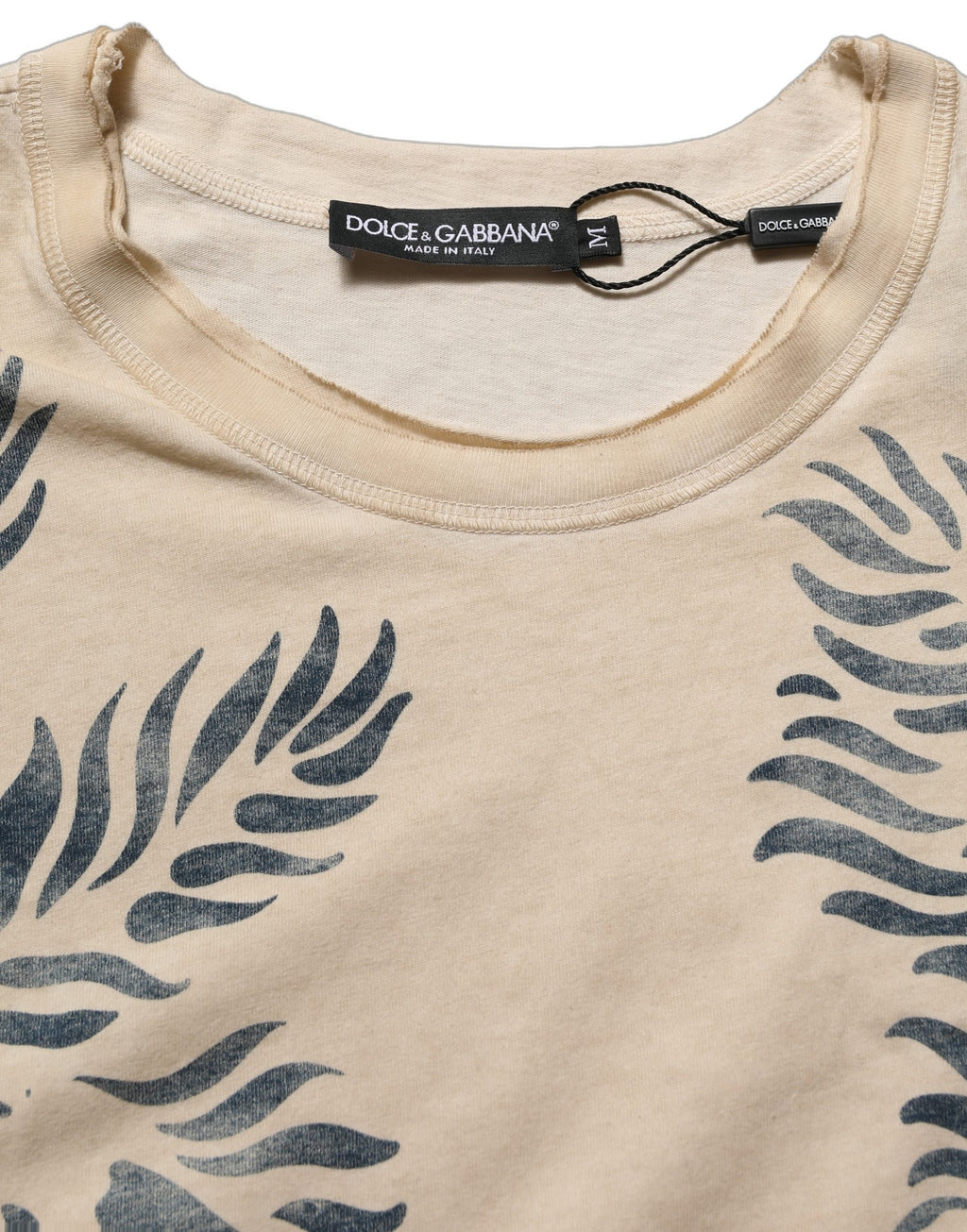 T-shirt beige en coton de Dolce & Gabbana avec imprimé graphique et col rond, vue frontale.