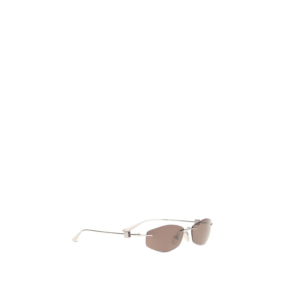 Lunettes de soleil en métal argenté Balenciaga, style moderne avec monture fine et verres teintés.