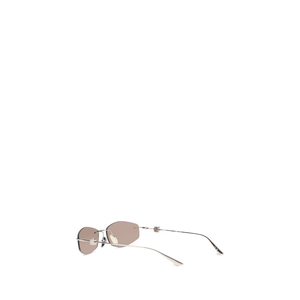 Lunettes de soleil en métal argenté Balenciaga, design moderne avec monture fine et verres teintés, style élégant et sophistiqué.