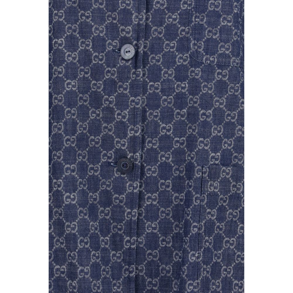 Veste longue en coton bleu Gucci, élégante et tendance, visible sur un mannequin avec détails du design et de la coupe.