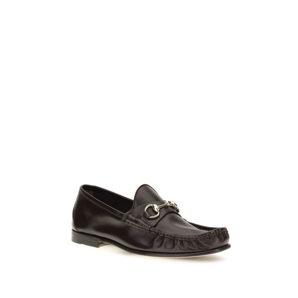 Chaussures Gucci en cuir de veau marron, mocassins slip-on Bos Taurus, élégants et sophistiqués pour homme.