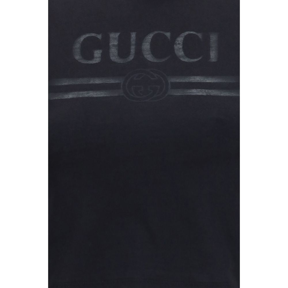 T-shirt en coton noir Gucci pour homme, coupe classique et logo Gucci visible sur la poitrine.