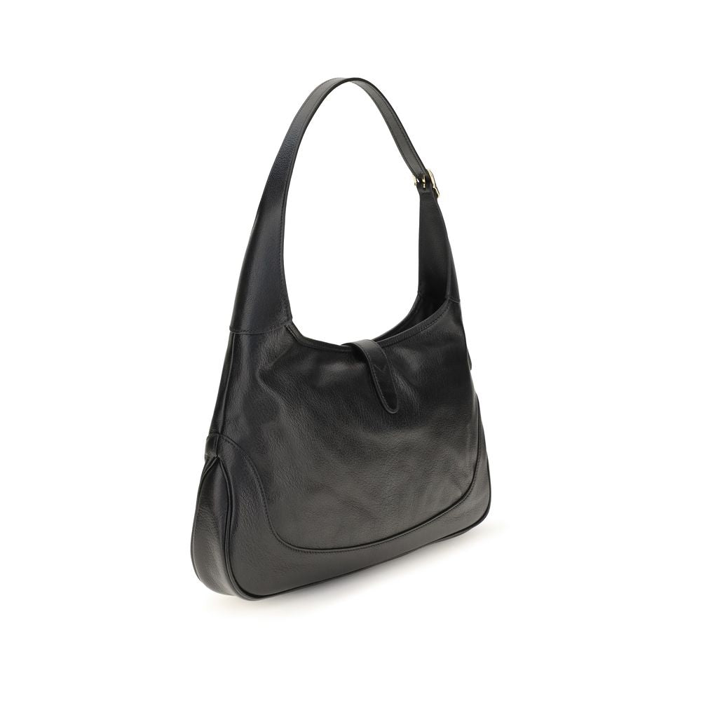 Sac à épaule Gucci Bos Taurus en cuir de veau noir, élégant et sophistiqué, avec détails en or et design moderne.