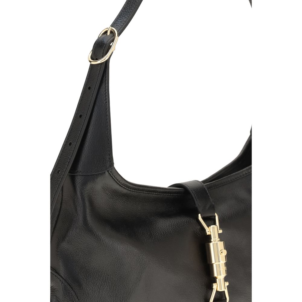 Sac à main Gucci Bos Taurus en cuir de veau noir, bandoulière élégante et finition raffinée, visible avec détails du produit.