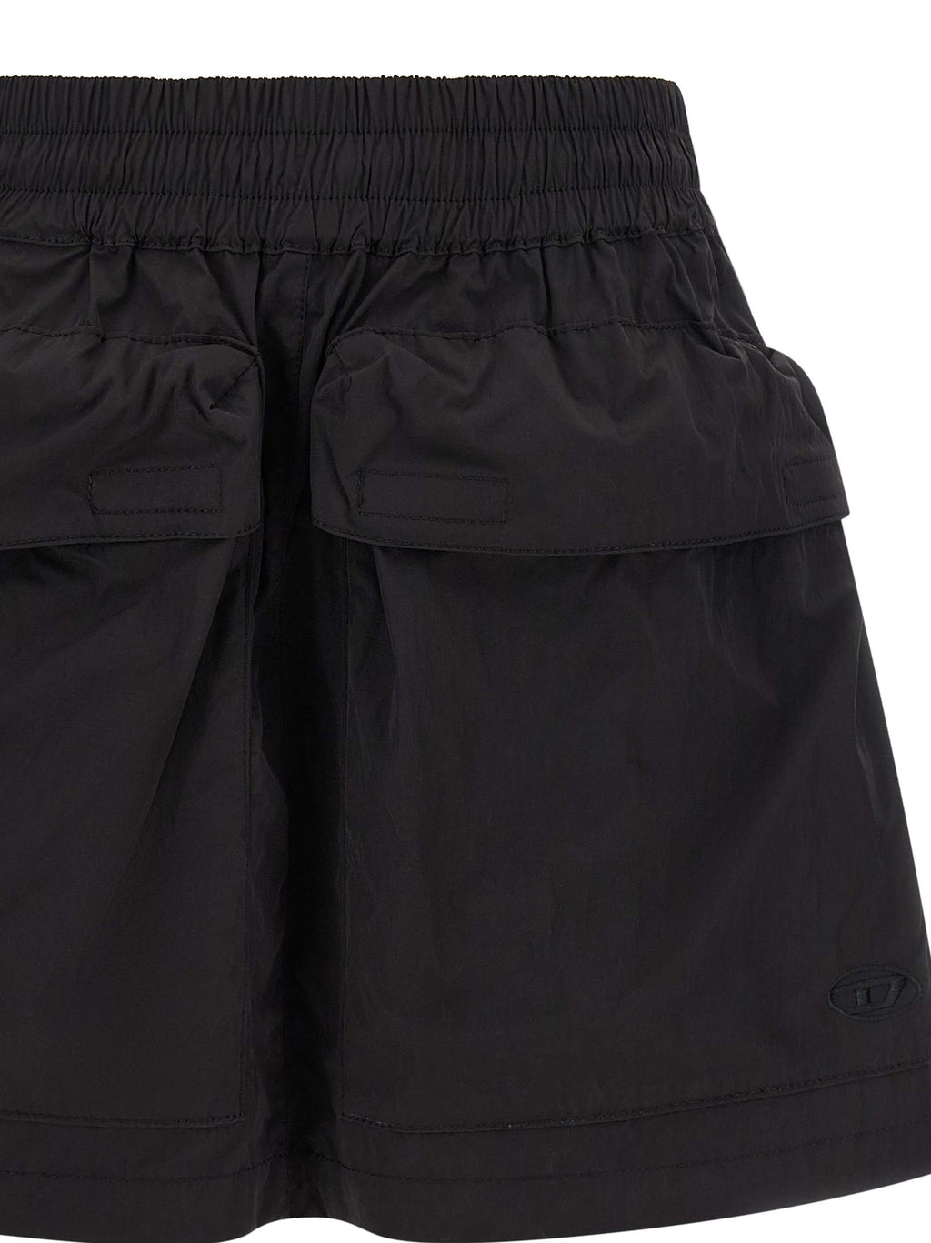 Jupe longue en polyamide noire de la marque Diesel, avec coupe fluide et détails modernes visible sur l'image.
