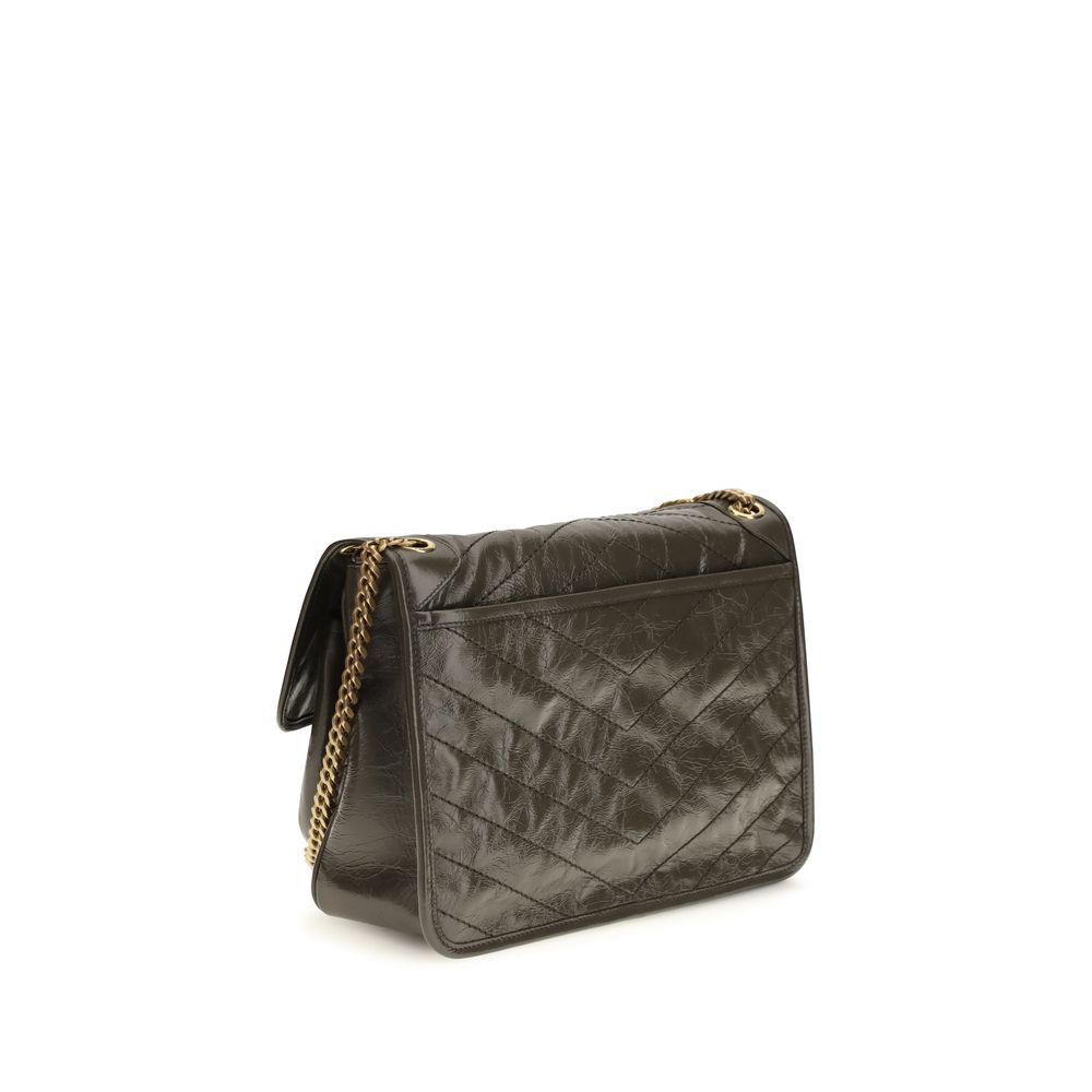 Sac à main Saint Laurent Bos Taurus en cuir de veau bicolore, élégant et sophistiqué, avec détails raffinés.