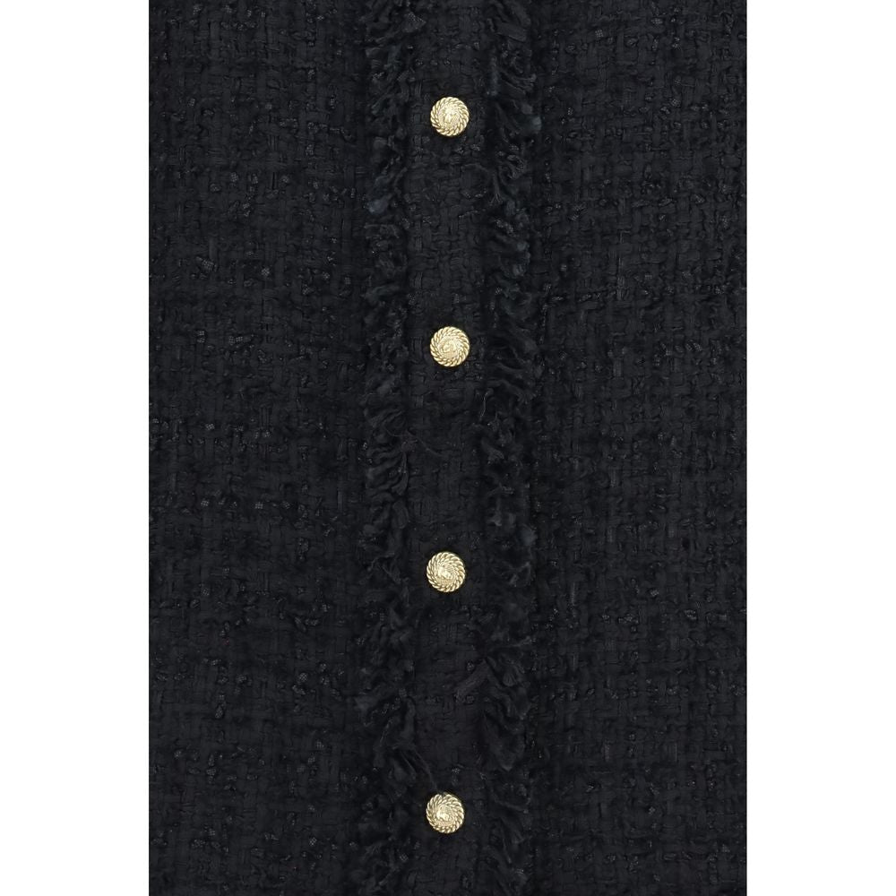 Chemise Balmain en polyamide noire avec motif, élégante et moderne, visible avec son design sophistiqué et tissu léger.