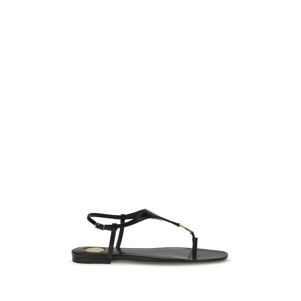 Sandales plates en cuir de veau noir Saint Laurent Bos Taurus, élégantes et raffinées pour femmes.
