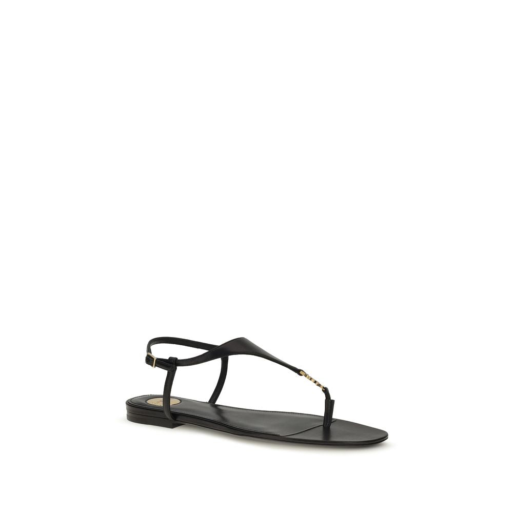 Sandales plates en cuir de veau noir Bos Taurus de Saint Laurent, design élégant et moderne, vue de dessus.