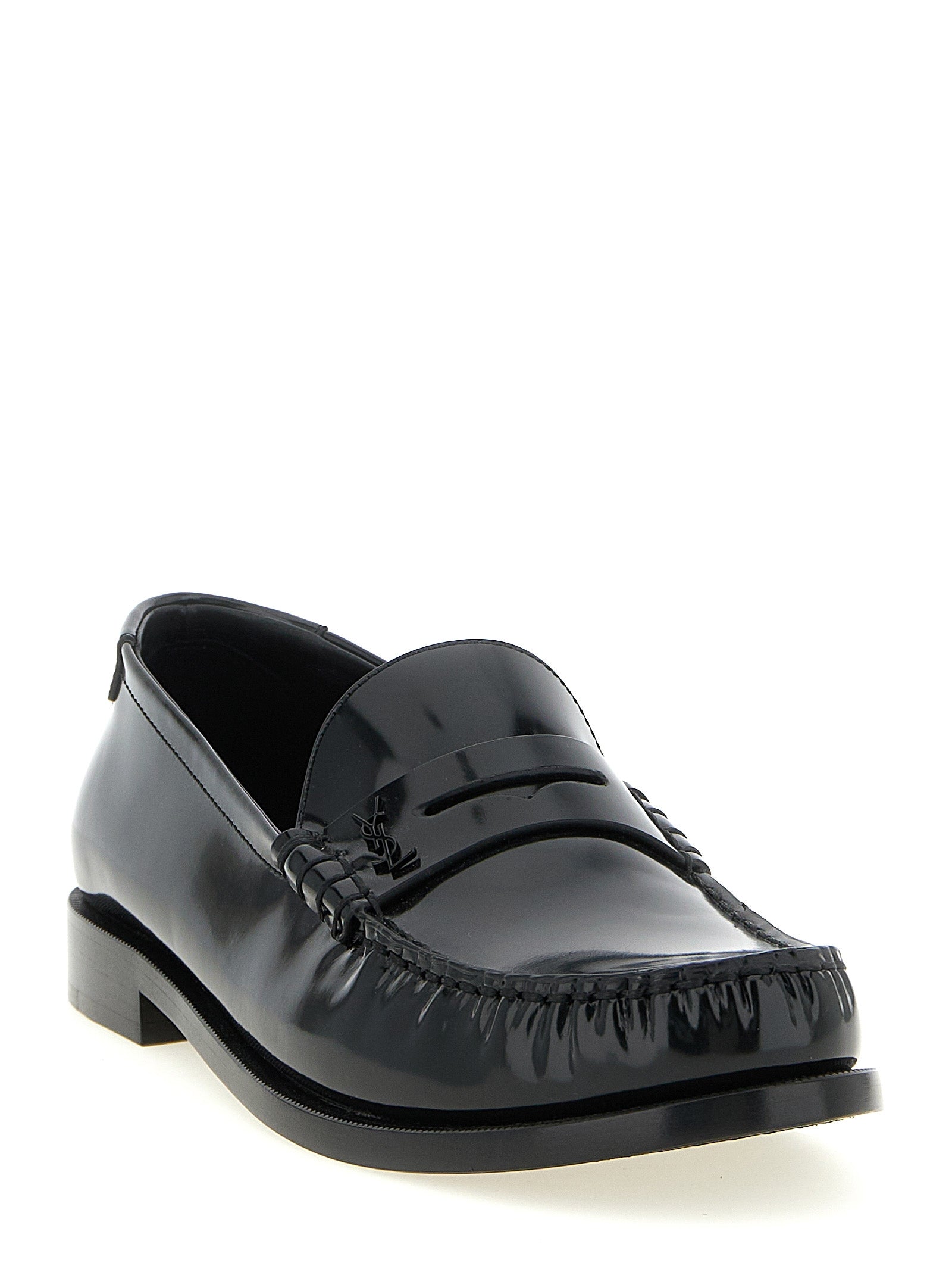 Chaussures mocassins Saint Laurent en cuir de veau noir, à enfiler élégantes et classiques pour homme.