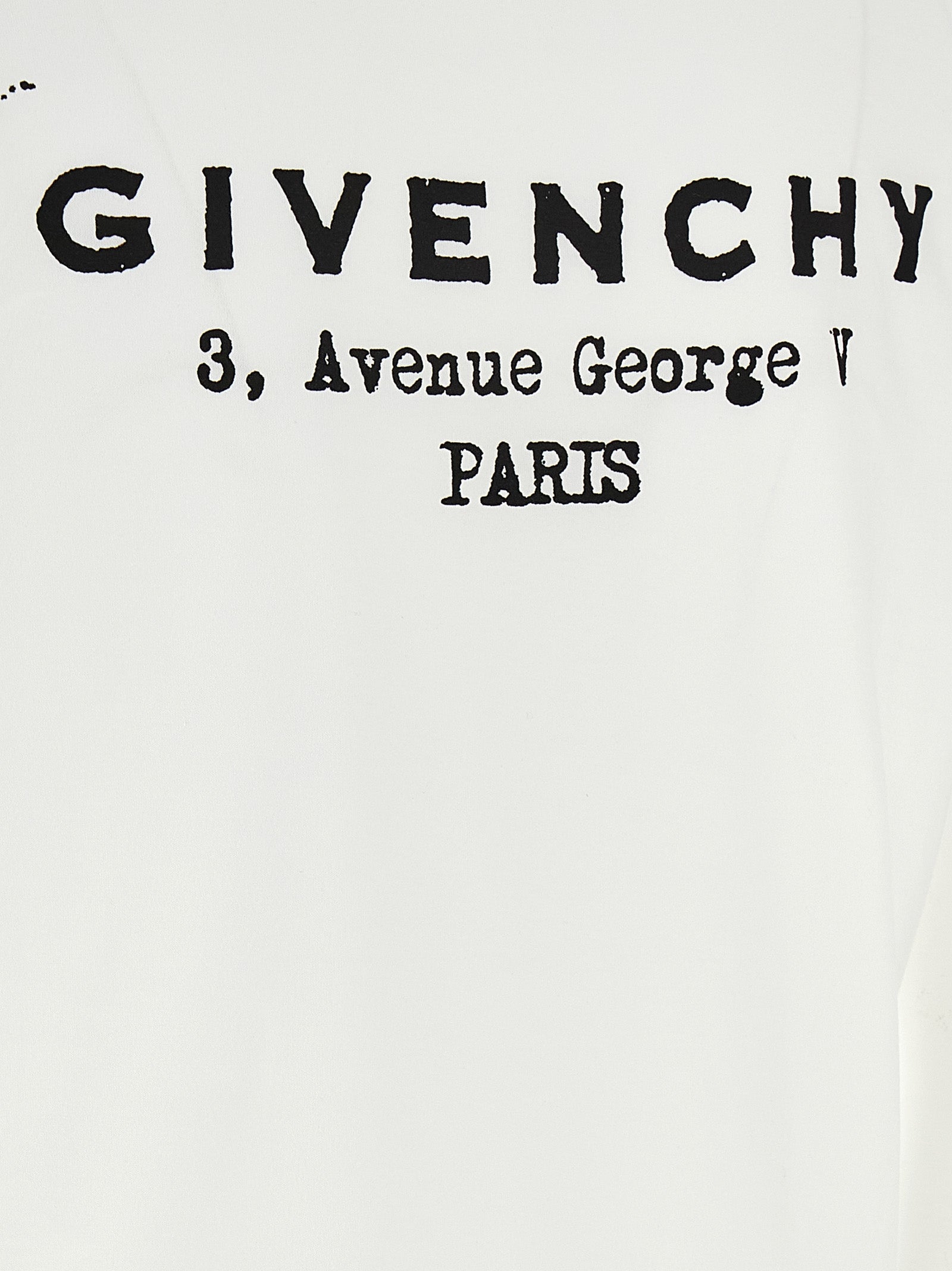 T-shirt en coton bicolore Givenchy, coupe classique, avec logo visible, porté sur mannequin, style élégant et moderne.