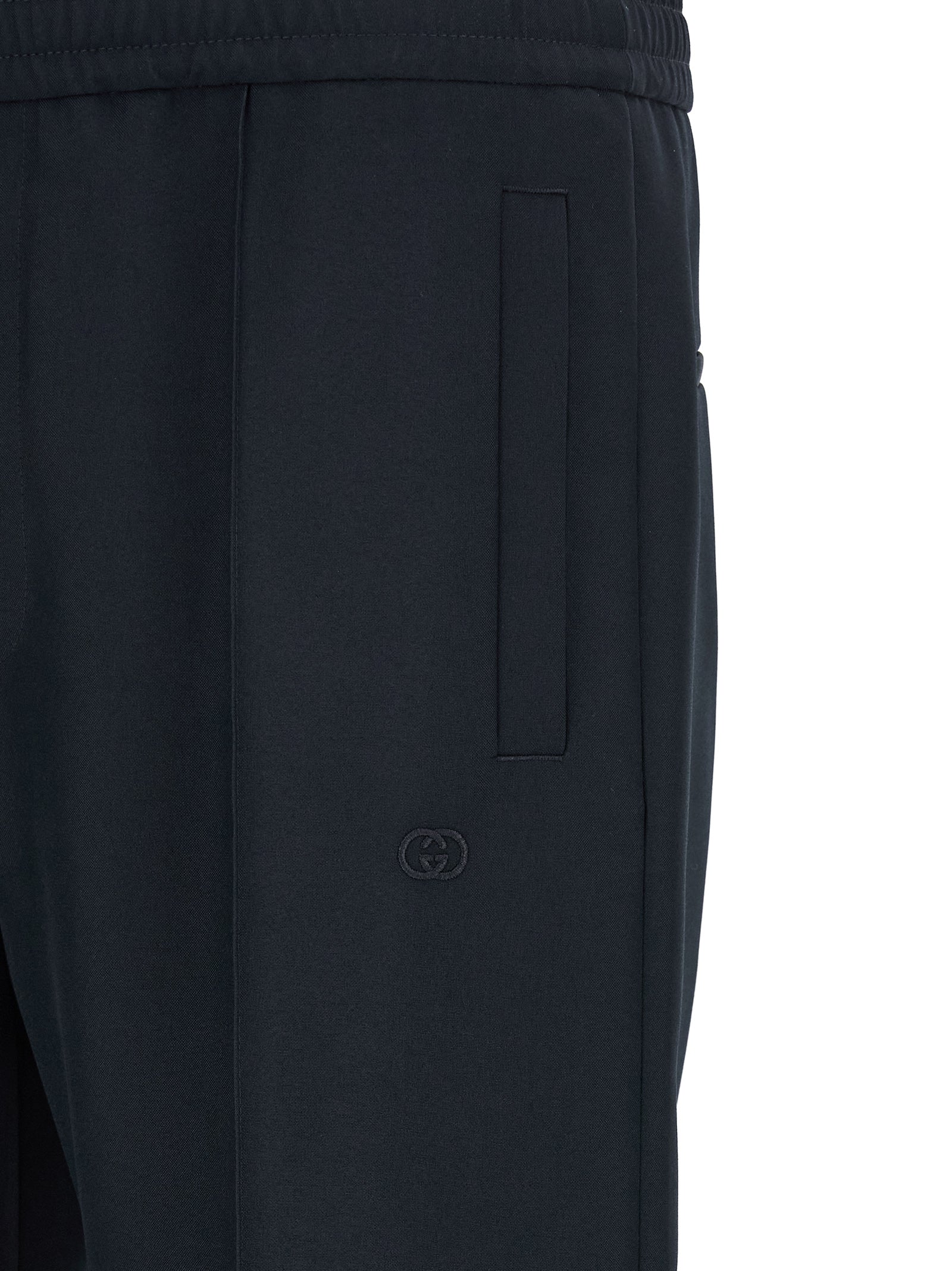 Pantalons décontractés en polyester bleu de Gucci, coupe régulière, avec ceinture ajustable et détails modernes.