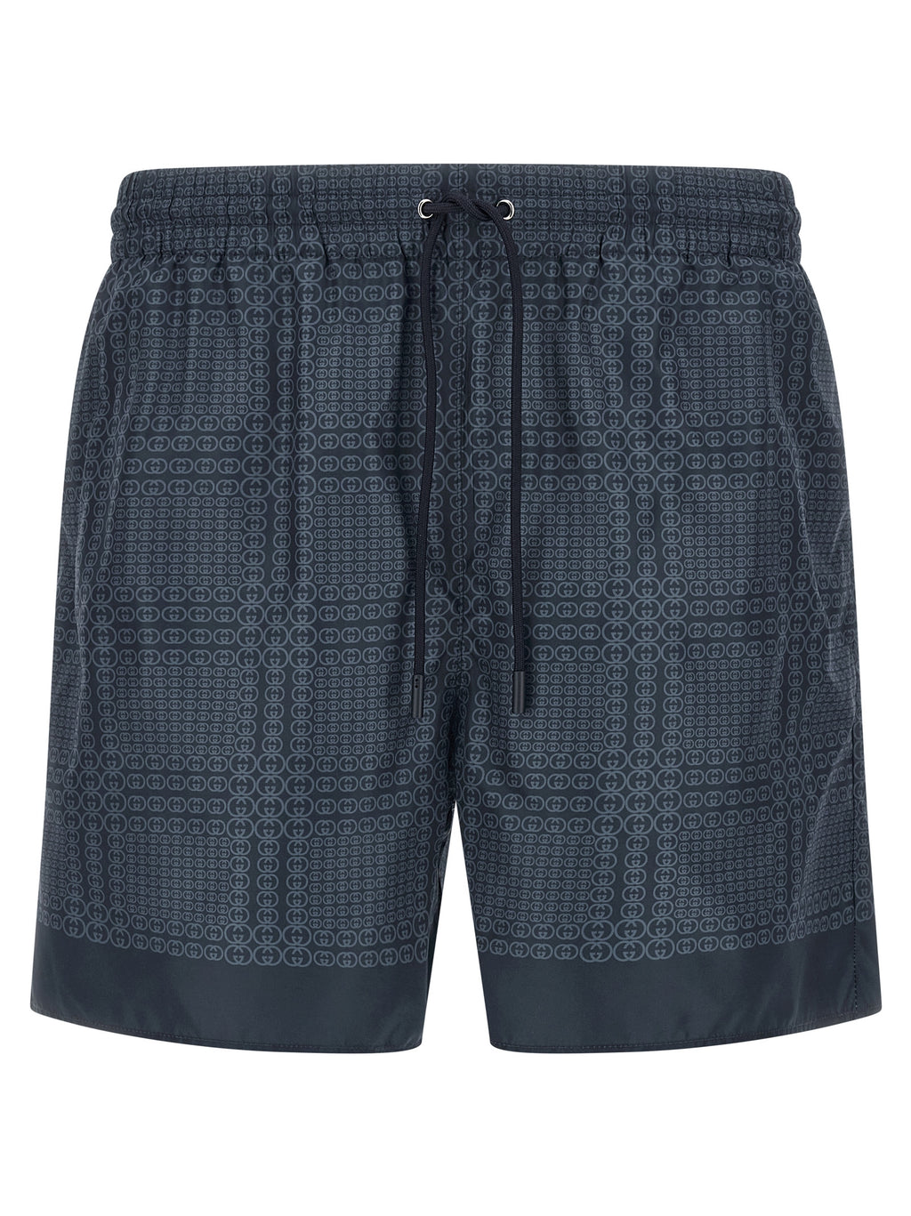 Shorts de bain en polyester bleu de Gucci, style décontracté, avec logo Gucci visible sur le devant.