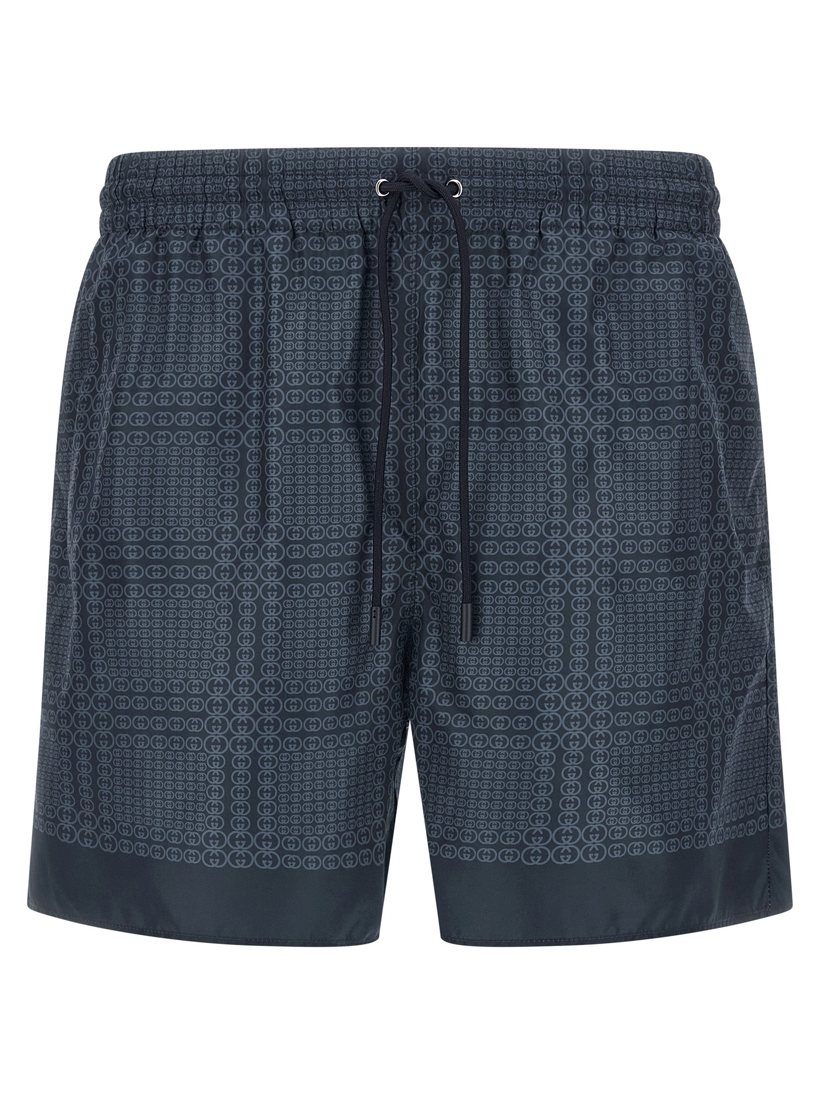 Shorts de bain en polyester bleu de Gucci, style décontracté, avec logo Gucci visible sur le devant.