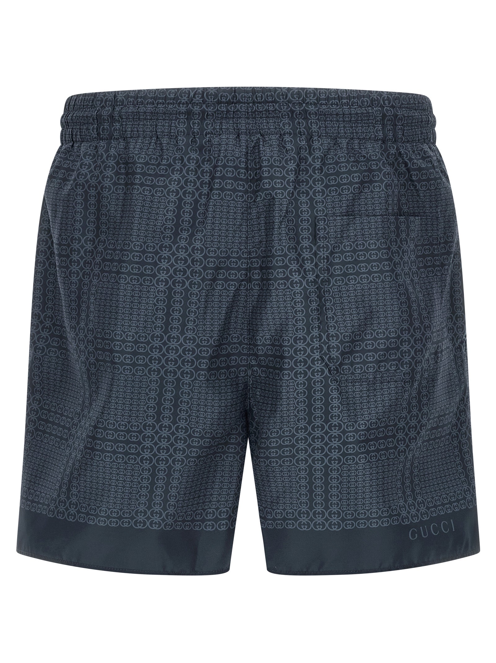 Shorts de bain en polyester bleu de Gucci, style décontracté avec logo Gucci visible sur le devant.
