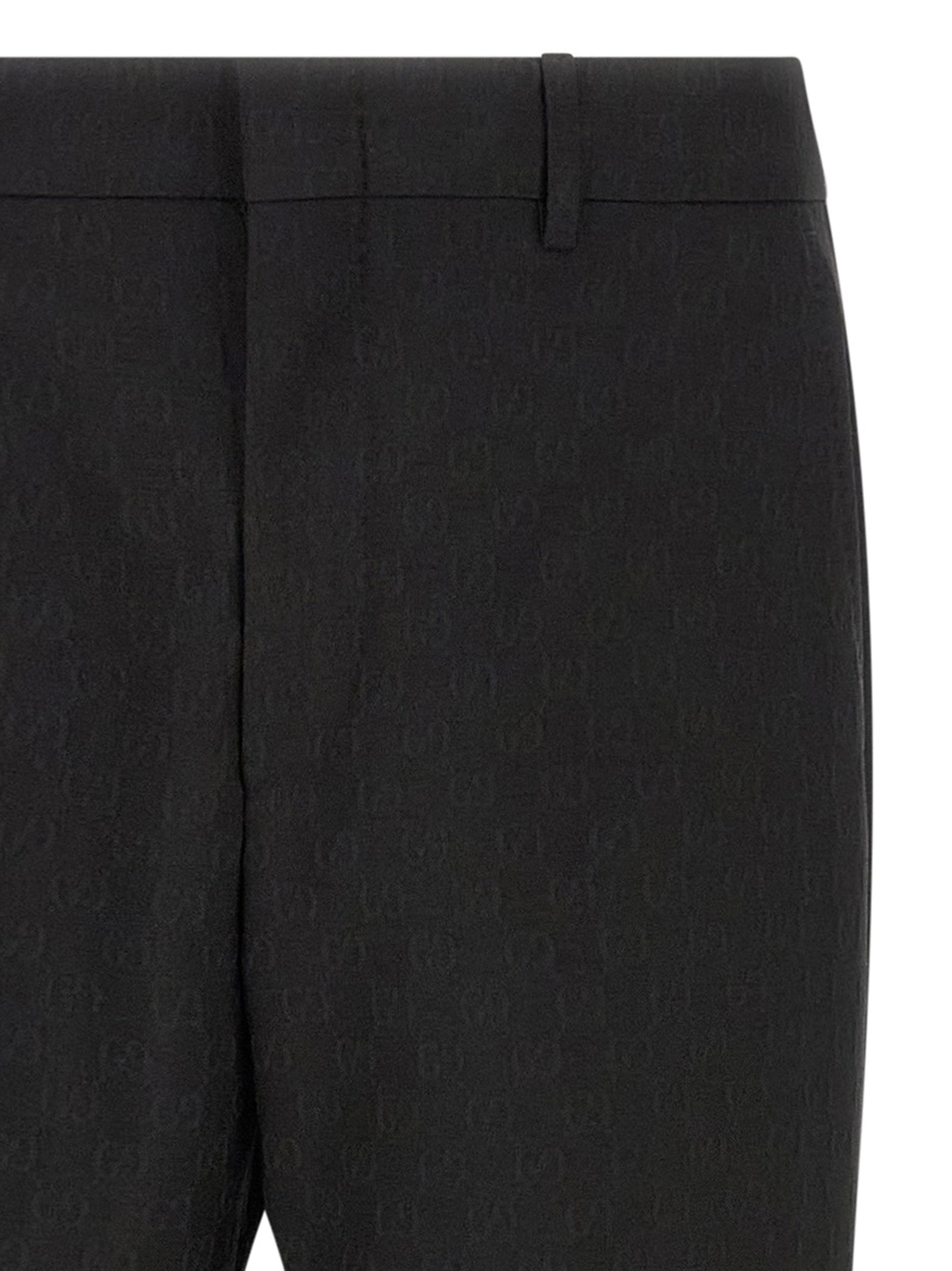 Pantalon de costume noir en polyester Gucci pour homme, élégante coupe classique visible sur l'image.