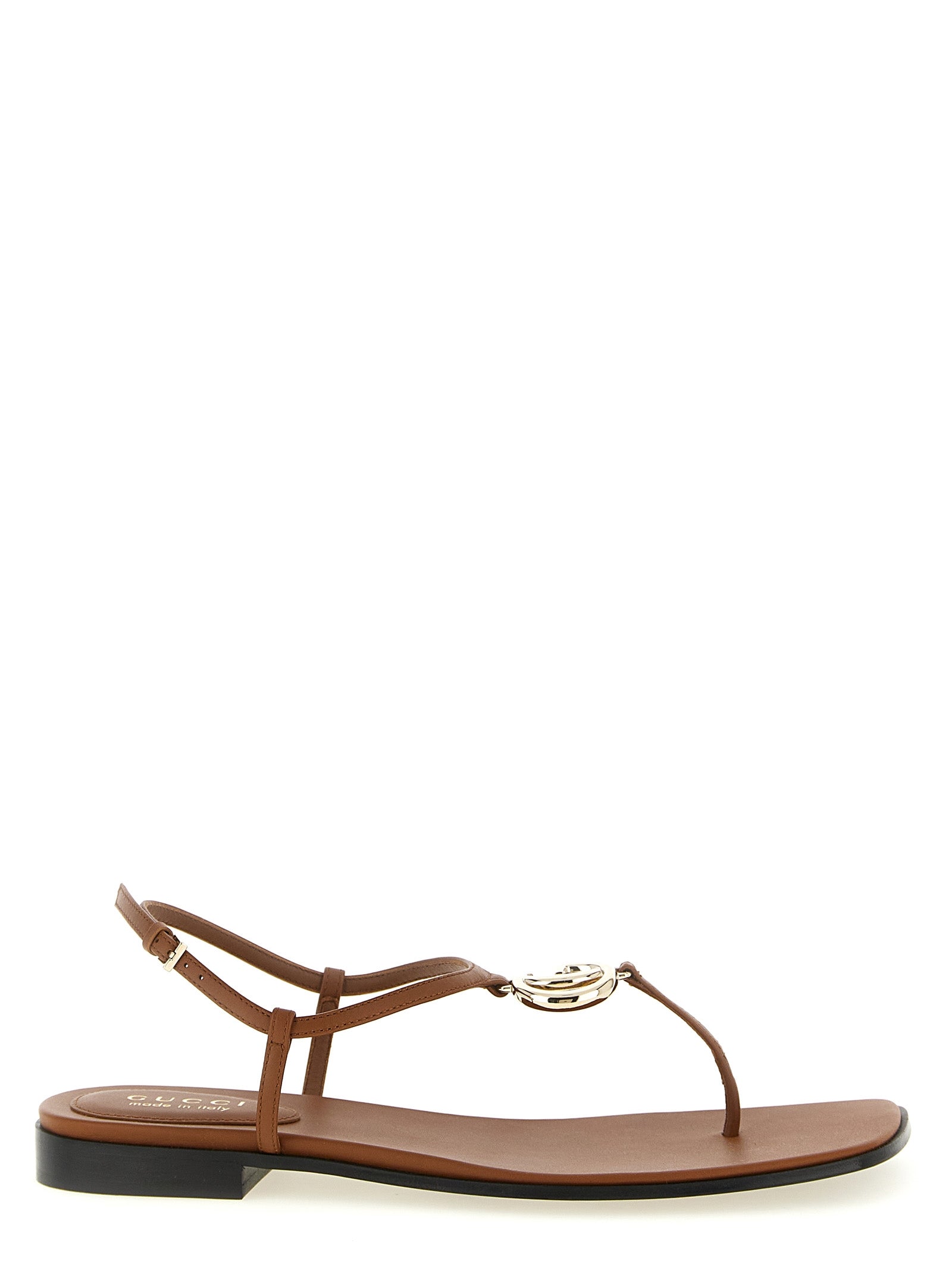 Sandales plates en cuir de veau marron Gucci, design élégant et confortable, pour un style sophistiqué et tendance.