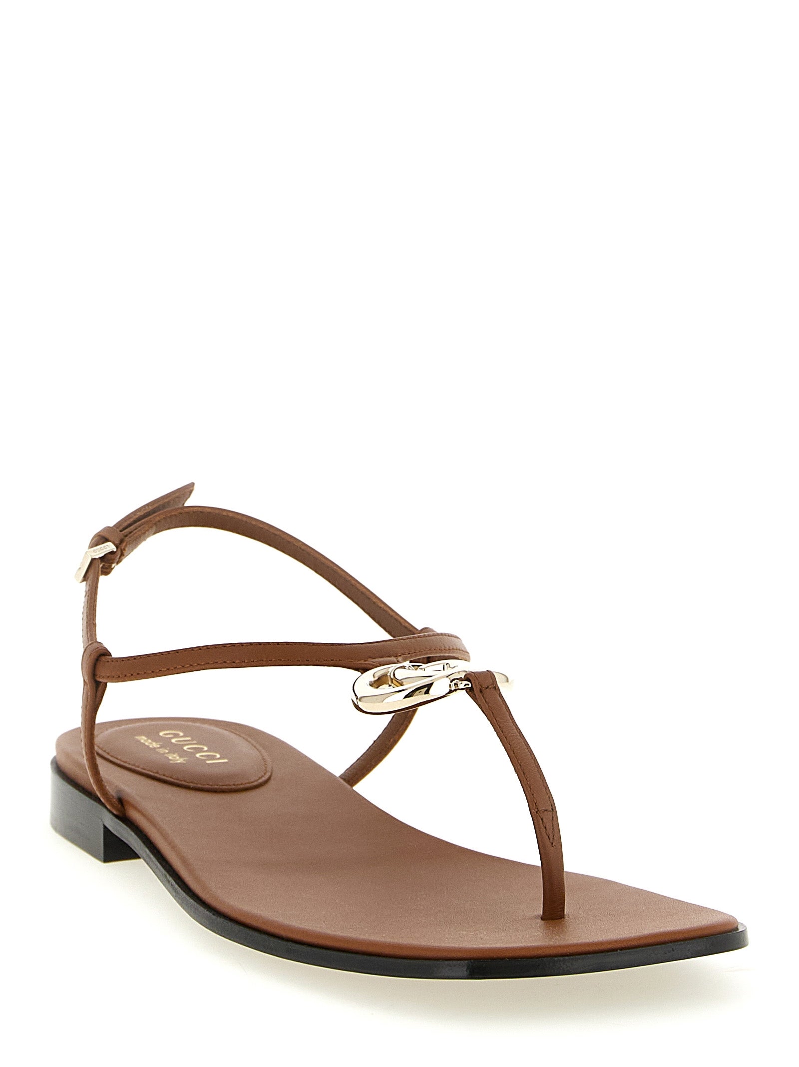 Sandales plates en cuir de veau marron Gucci, chaussures élégantes pour femmes avec design épuré.
