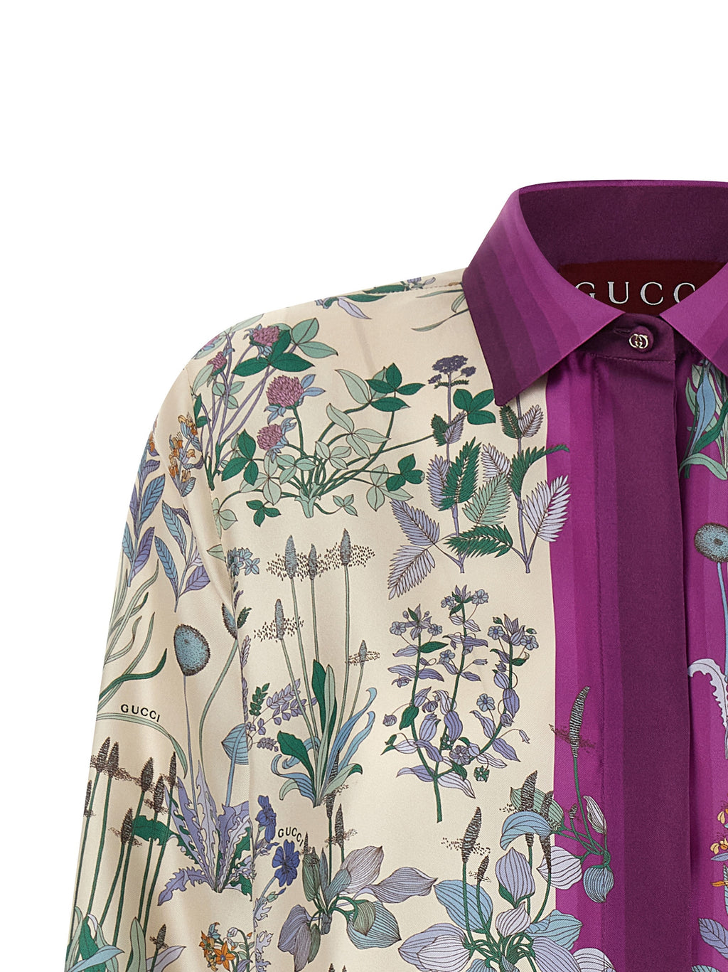 Chemisier en soie multicolore Gucci avec motifs élégants, détails raffinés et coupe fluide visible sur l'image.