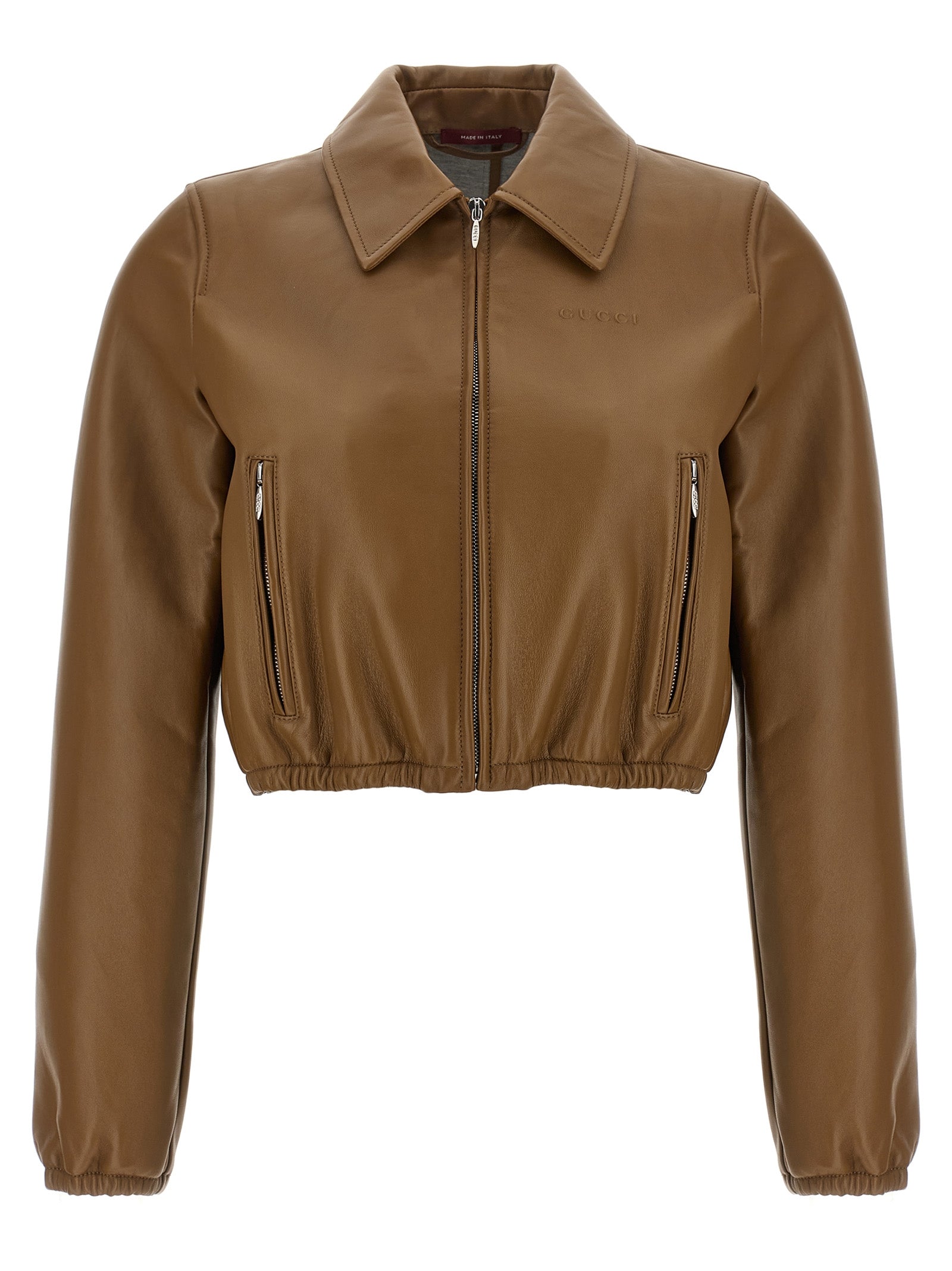 Veste en cuir d'agneau beige de Gucci, coupe élégante et détails sophistiqués, vue de face sur un mannequin.