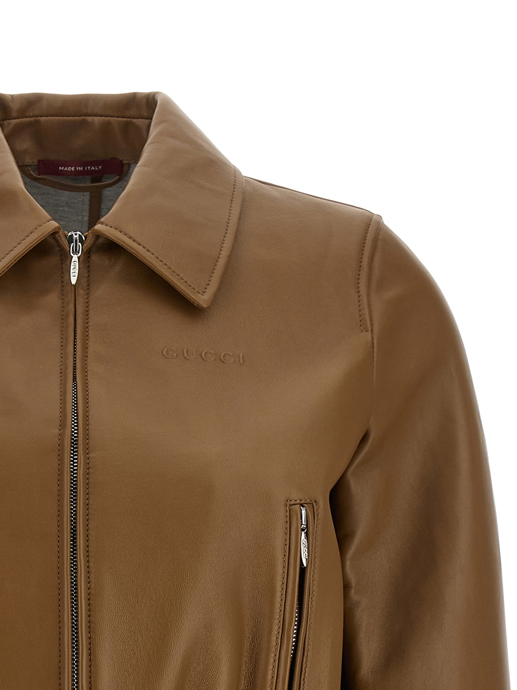 Veste en cuir beige pour femme de Gucci, en agneau, avec coupe élégante et détails sophistiqués.