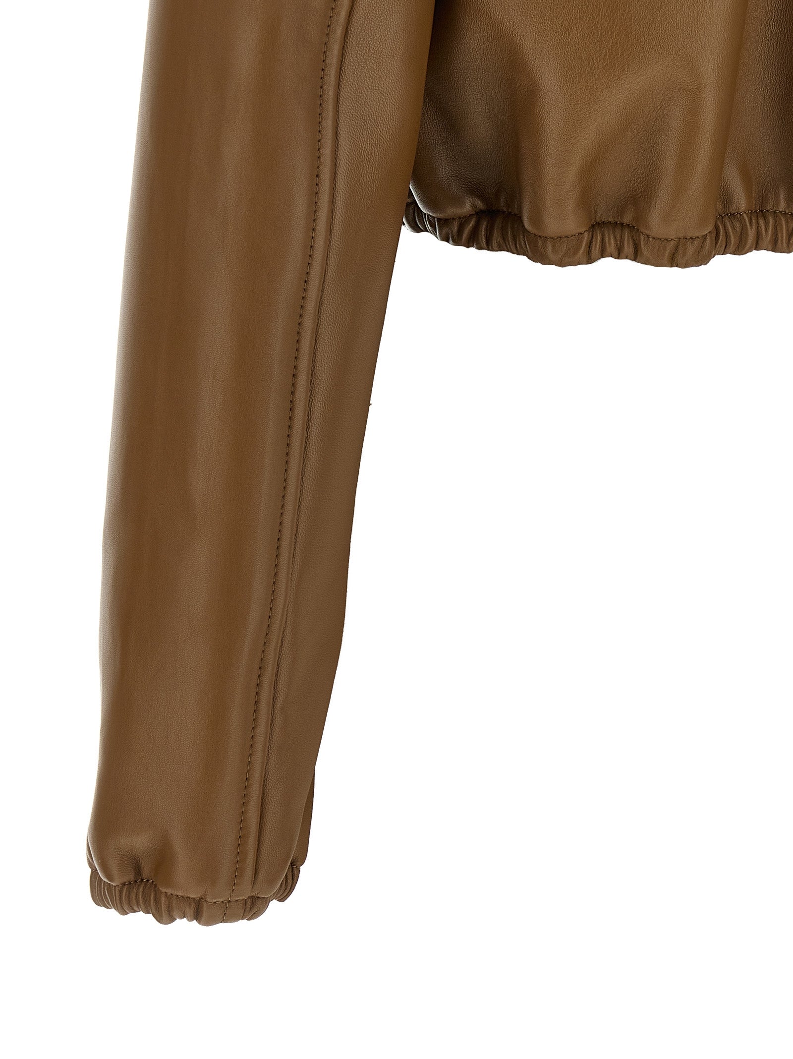 Veste en cuir d'agneau beige de Gucci, design élégant avec détails raffinés, visible sur cette image.
