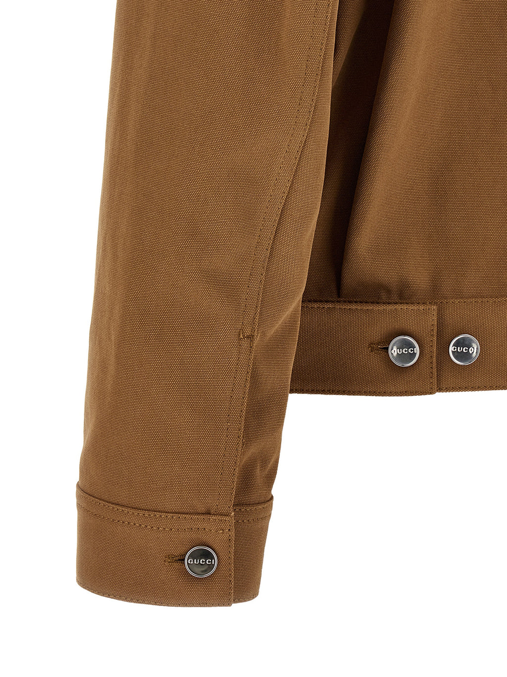 Veste longue en coton marron de Gucci, style élégant, avec fermeture à boutons et détails modernes visible sur l'image.