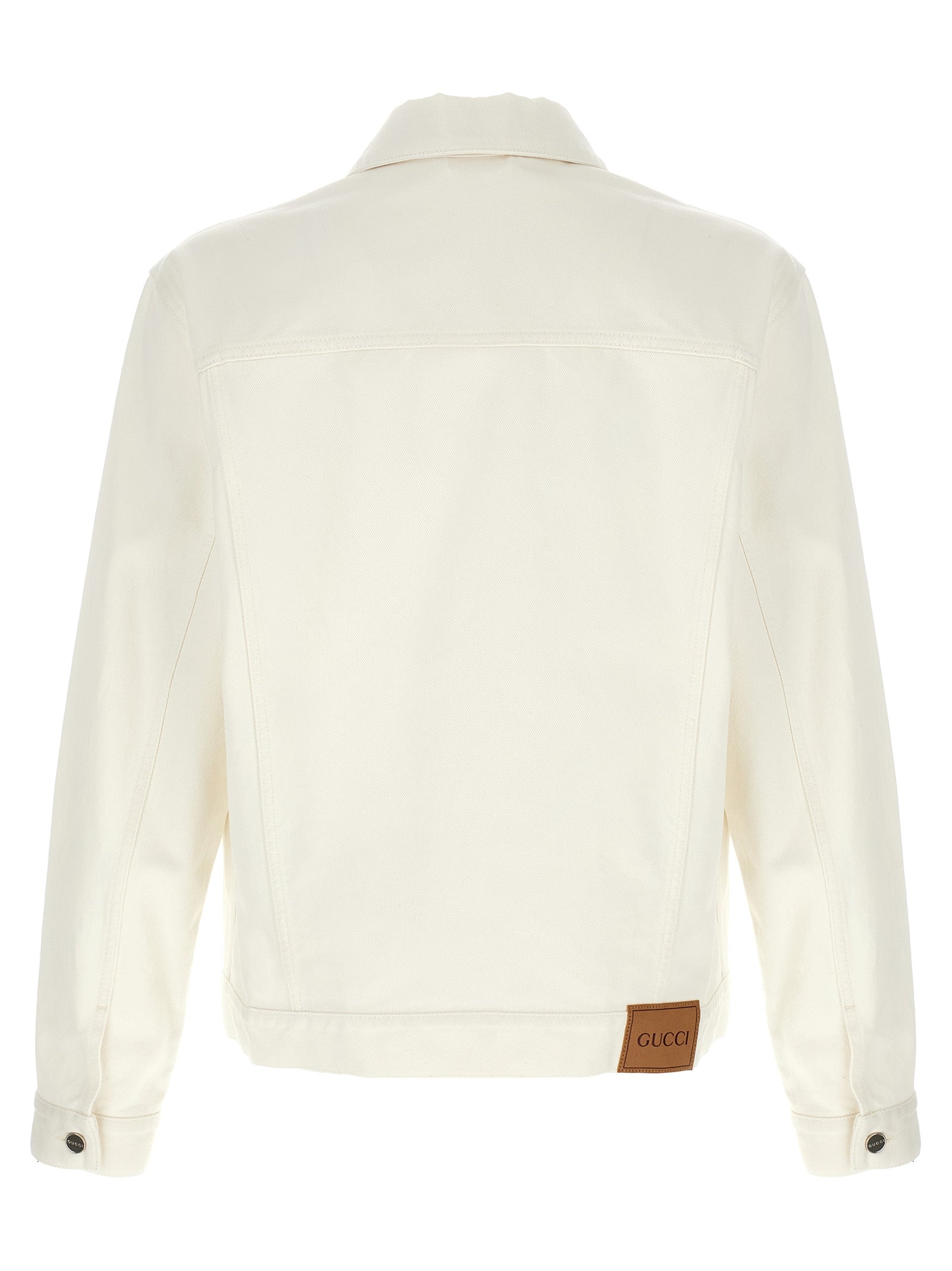 Veste en denim blanc Gucci en coton, vue de face, détaillée avec logo Gucci sur la poitrine, mode élégante et décontractée.