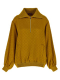 Cardigan bicolore en viscose Gucci, vue de près, avec détails de finition élégants et logo Gucci visible.