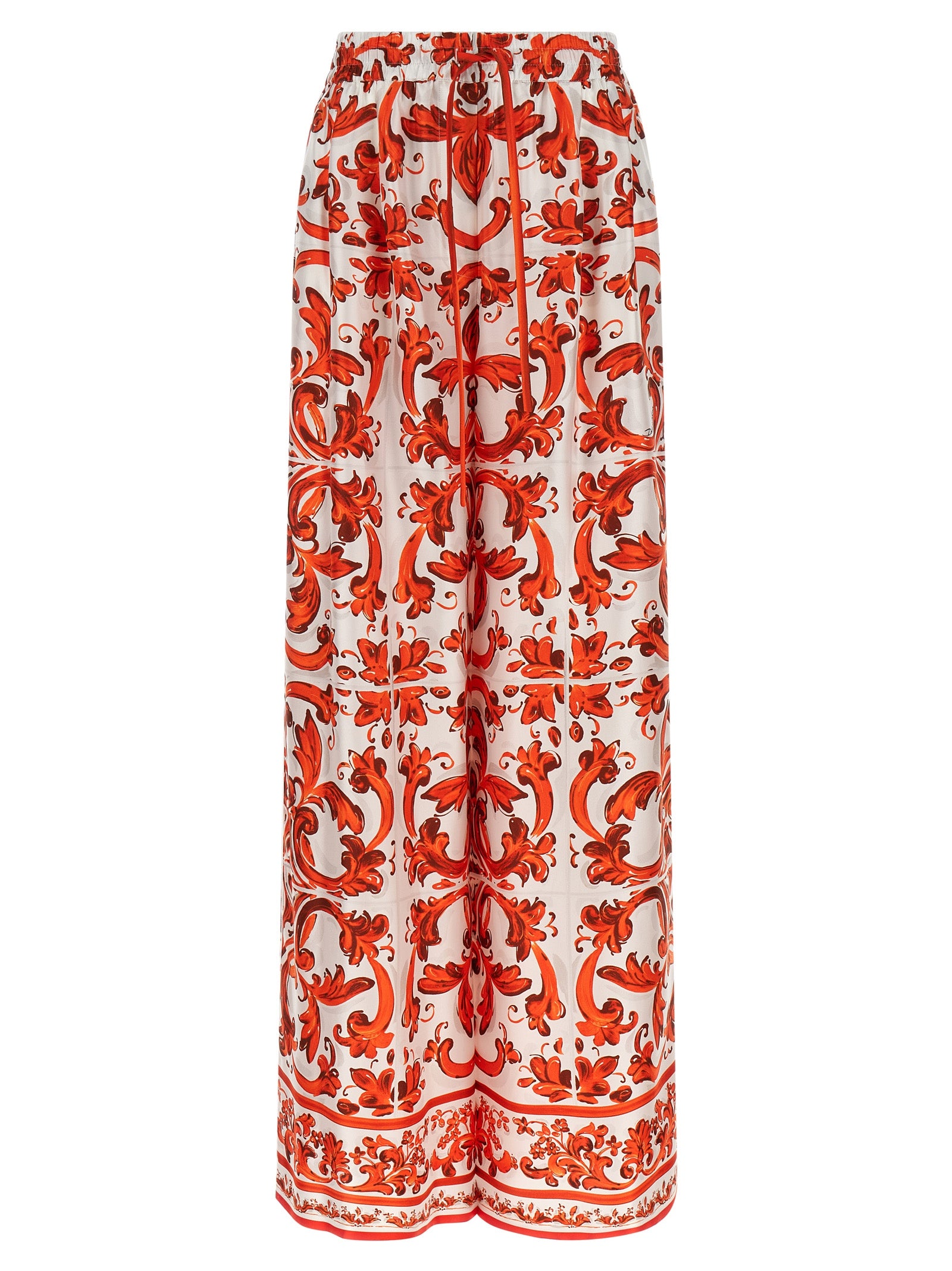 Pantalons évasés en soie orange de Dolce & Gabbana, style élégant et fluide, vue détaillée de la matière et de la coupe.