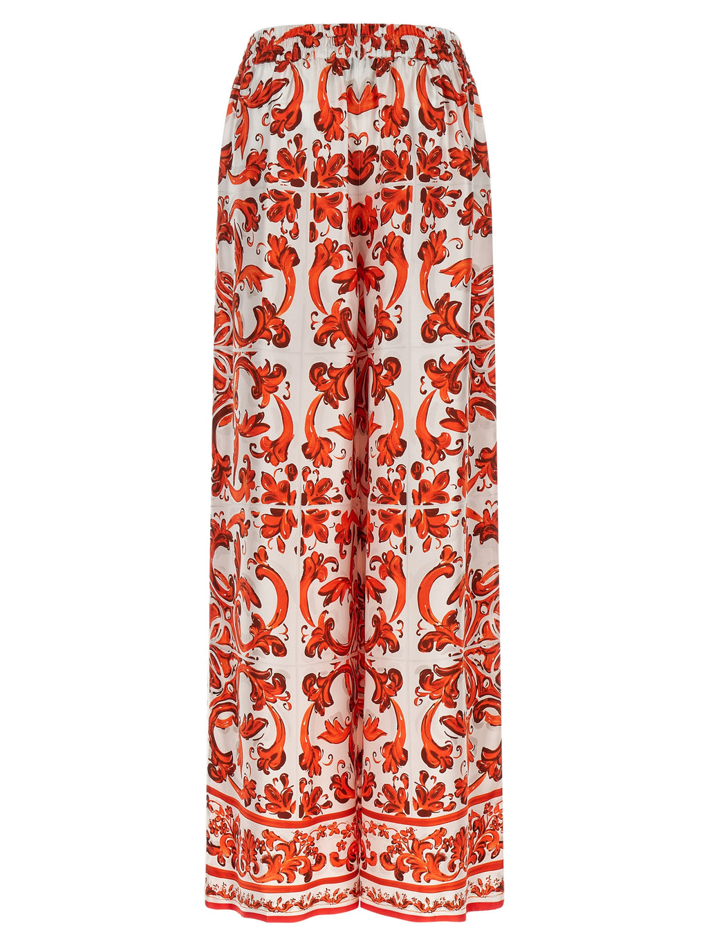 Pantalons évasés en soie orange de Dolce & Gabbana, style élégant et fluide, affichés sur un mannequin.