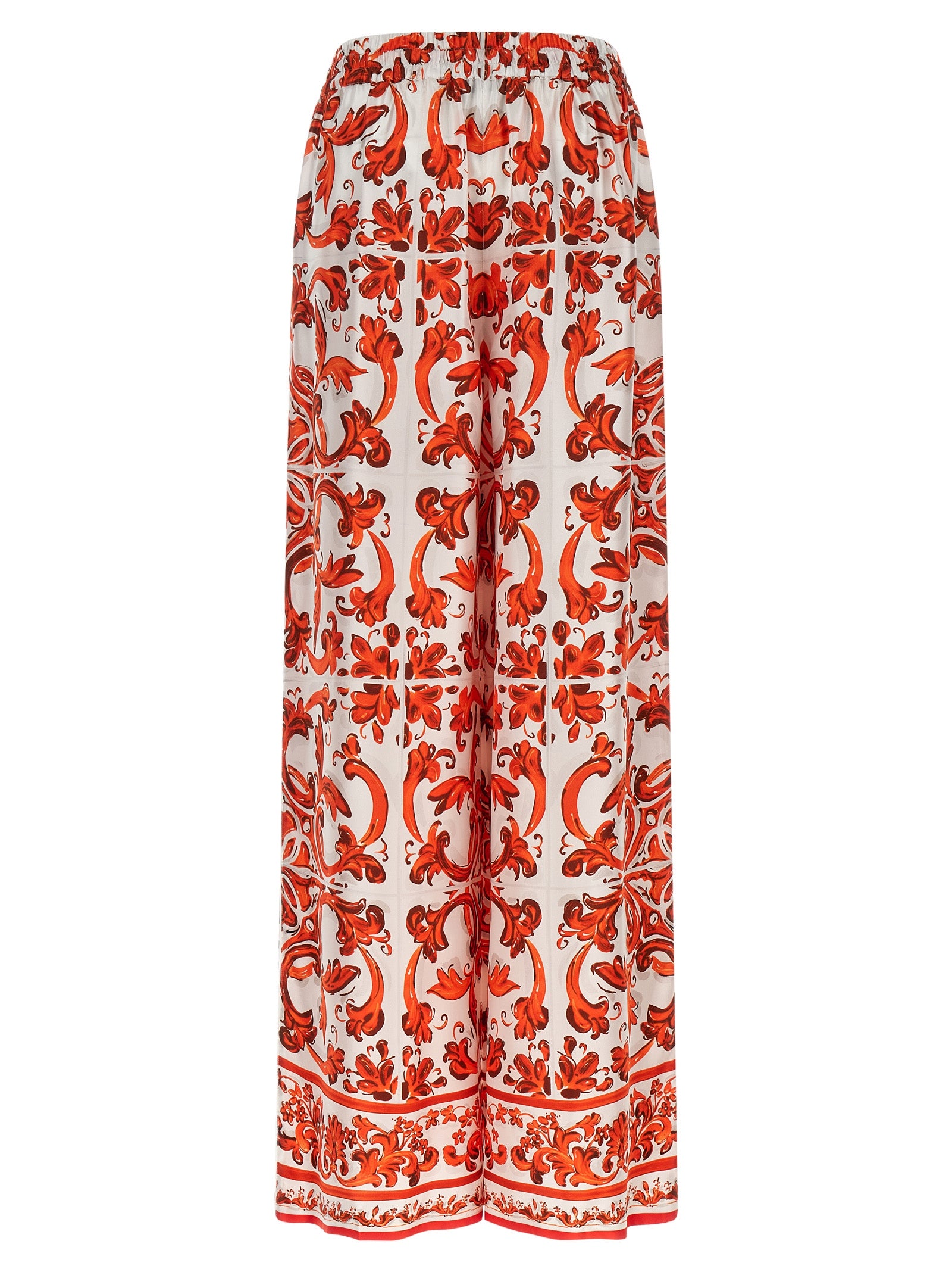 Pantalons évasés en soie orange de Dolce & Gabbana, style élégant et fluide, affichés sur un mannequin.