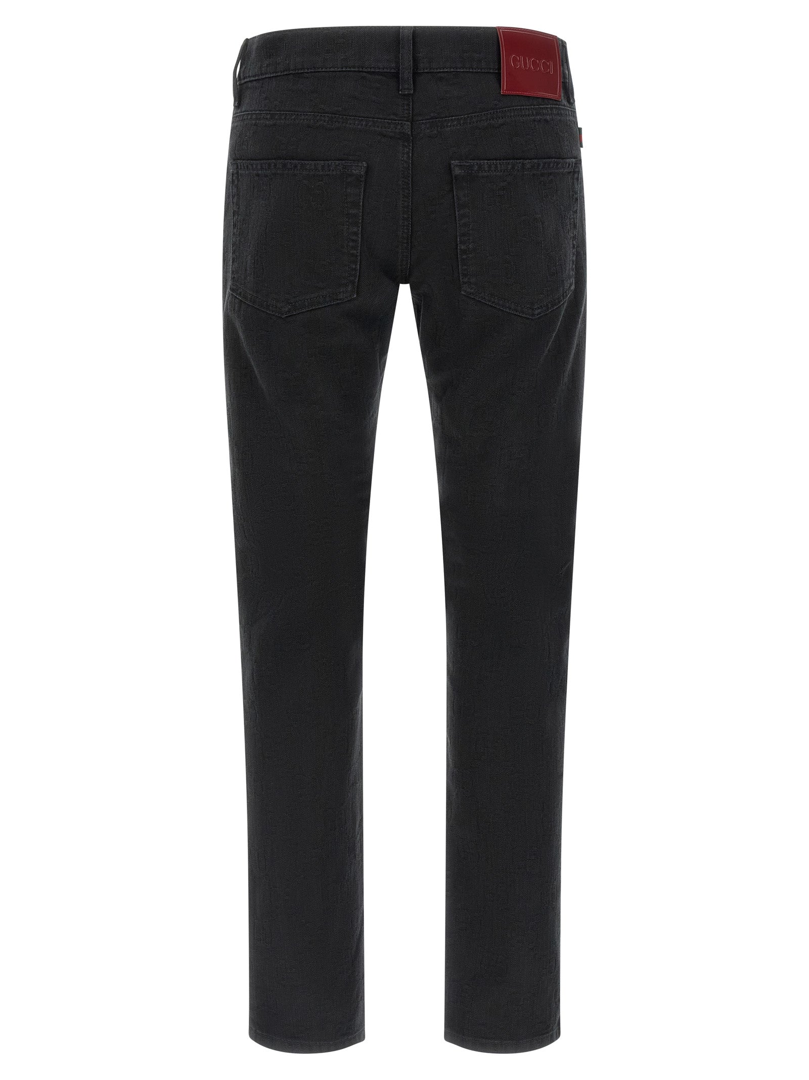 Jeans droits en coton noir de Gucci, style classique, avec détails de couture visibles, parfaits pour un look décontracté.