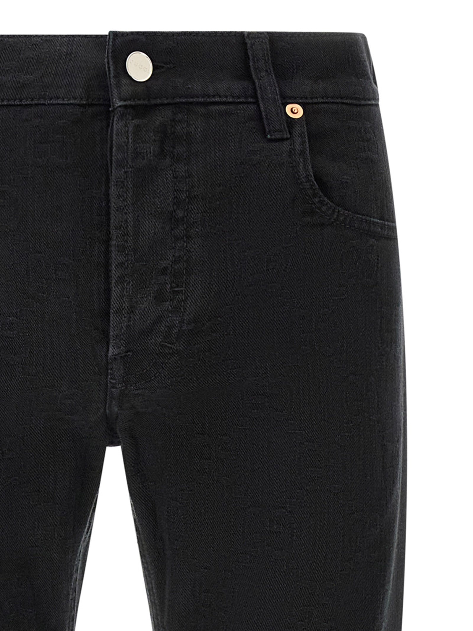 Jeans droits en coton noir Gucci, vêtement décontracté avec coupe classique, visible en détail sur le produit.
