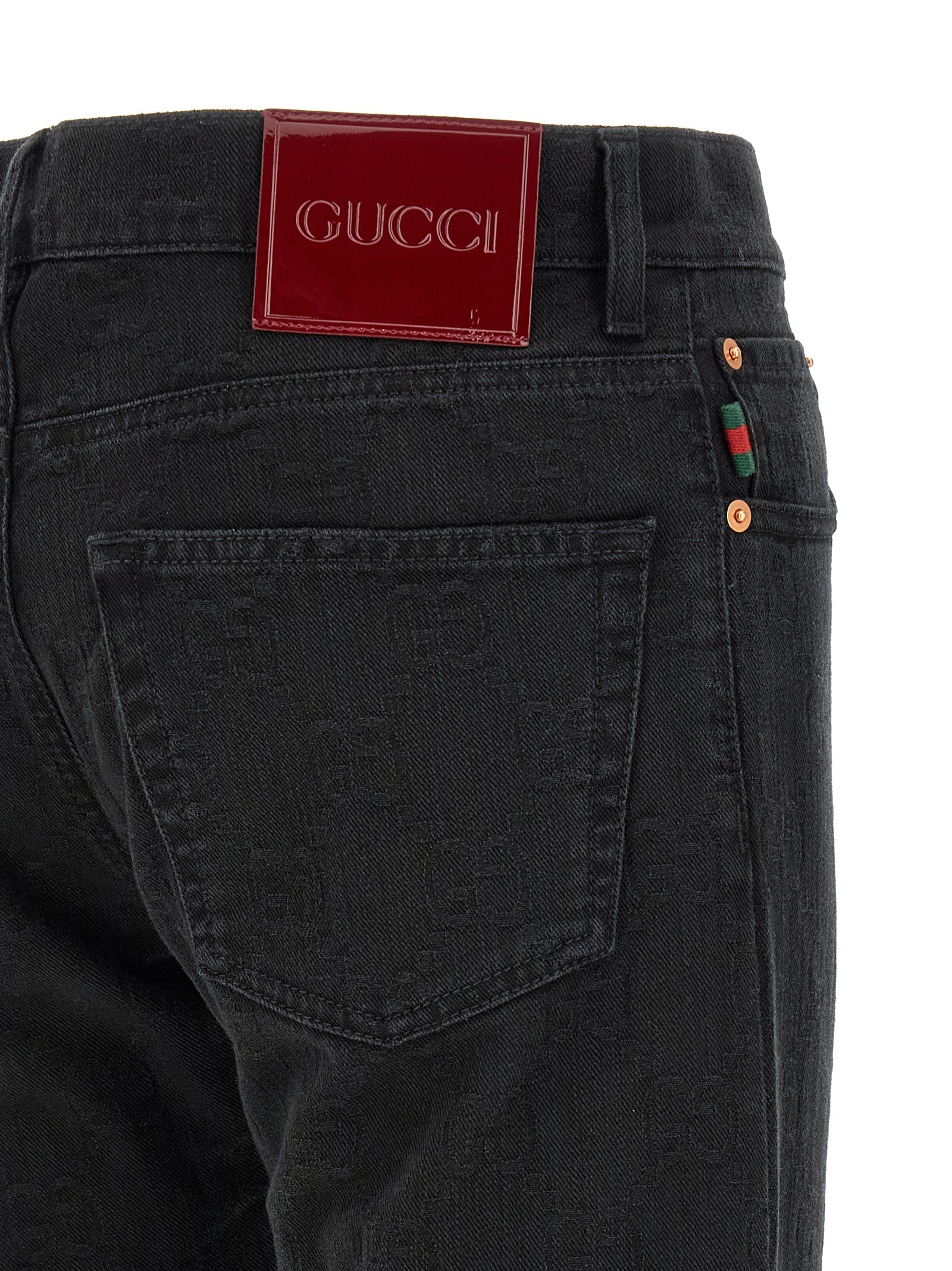 Jeans Gucci en coton noir à coupe droite, visibles avec détails et poches, parfaits pour un style décontracté et élégant.