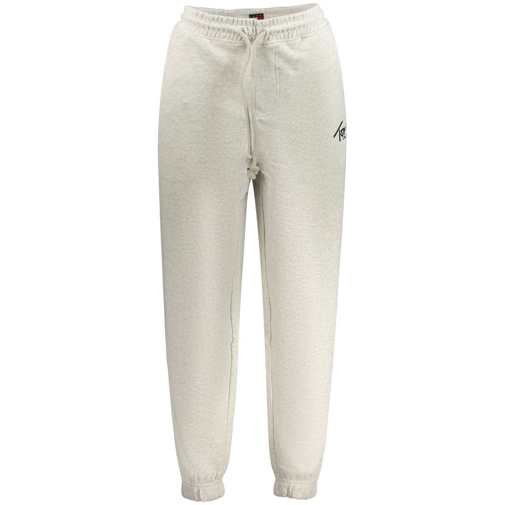 Pantalon en coton gris pour homme de la marque Tommy Hilfiger, ajusté et élégant, posé sur un fond neutre.