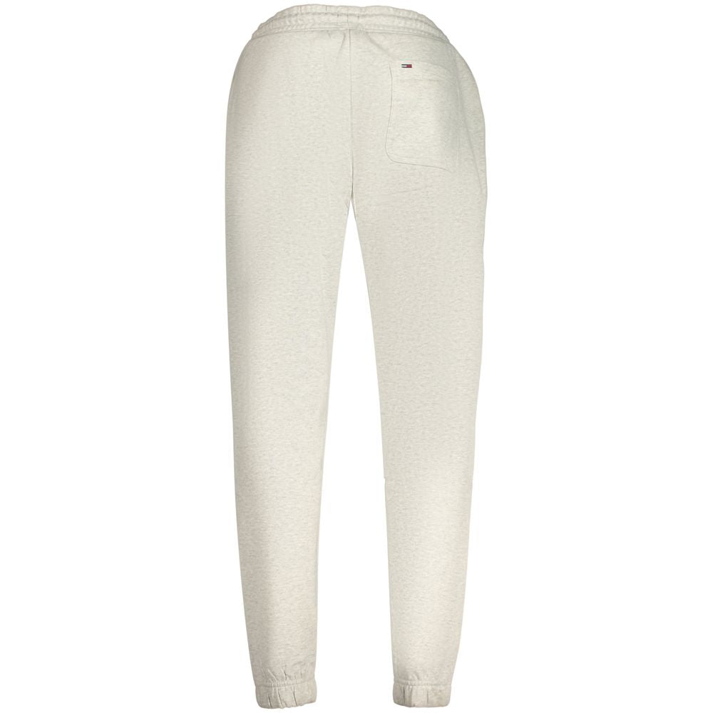 Pantalon gris en coton pour homme de la marque Tommy Hilfiger, coupe classique avec ceinture et poches frontales.