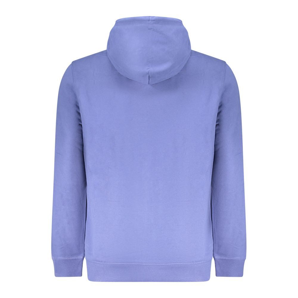 Sweatshirt homme en coton bleu Tommy Hilfiger, col rond et manches longues, portée décontractée.