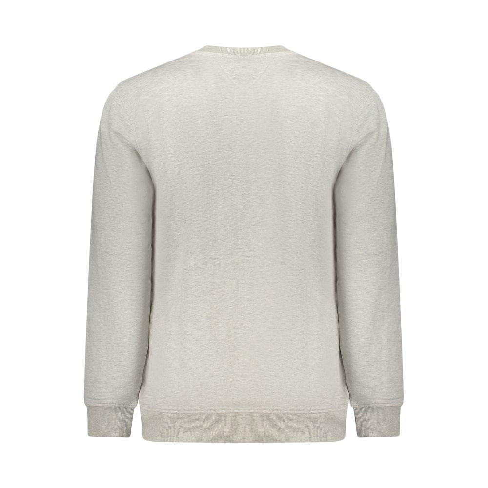 Sweatshirt gris en coton pour homme de la marque Tommy Hilfiger, avec col rond et logo discret sur la poitrine.