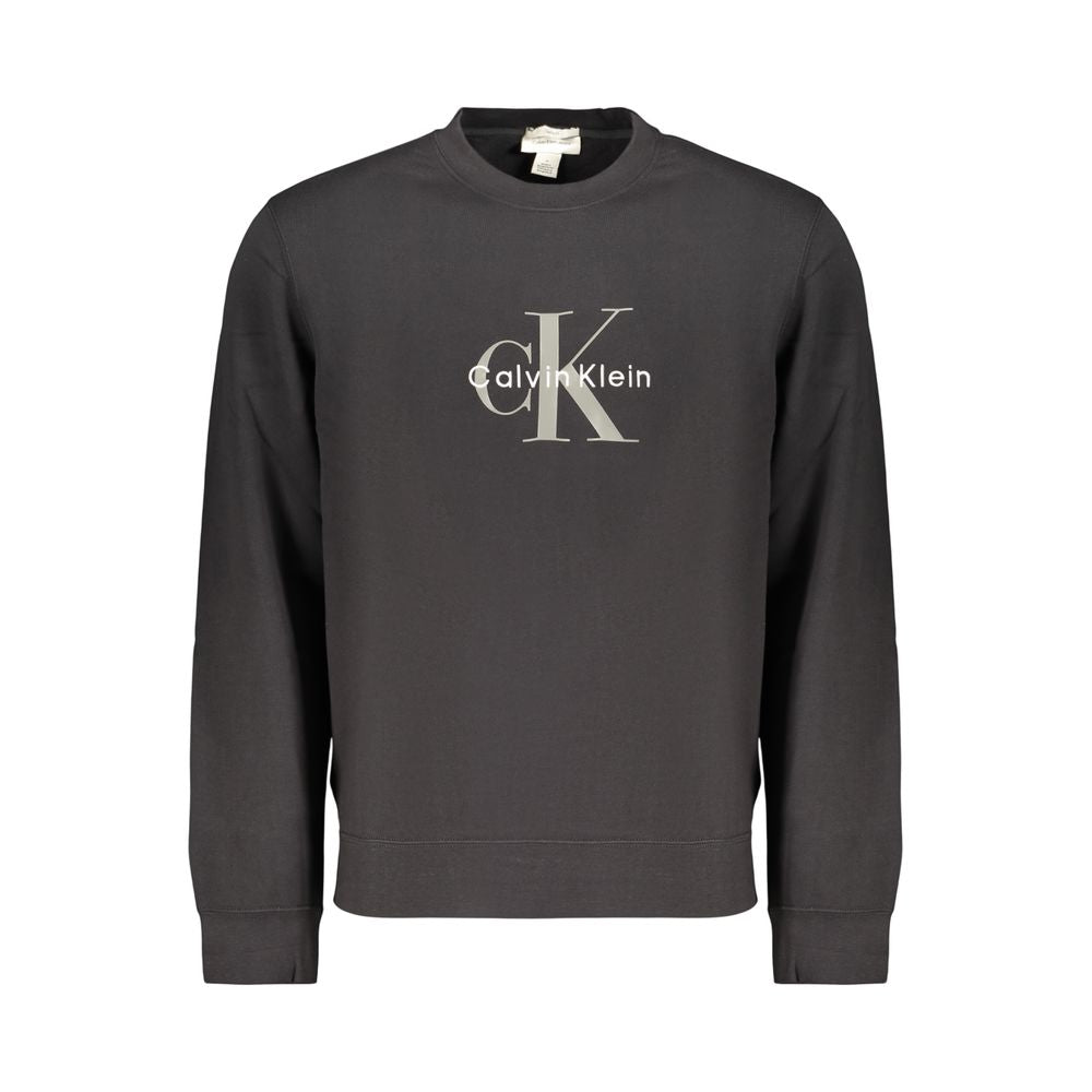 Sweat-shirt homme en coton noir de Calvin Klein, col rond et design simple, porté par un mannequin.