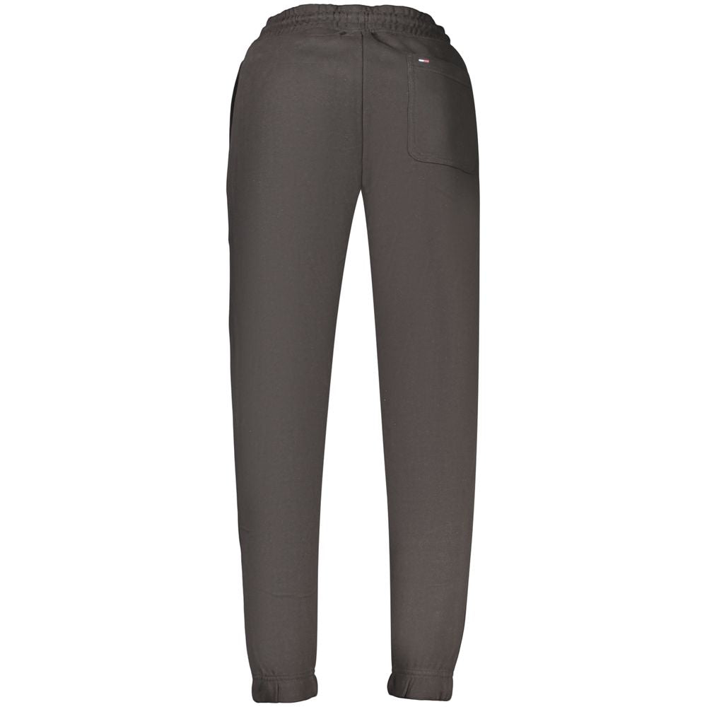 Pantalon homme Tommy Hilfiger en coton noir, style classique, ajusté, avec ceinture et poches visibles.