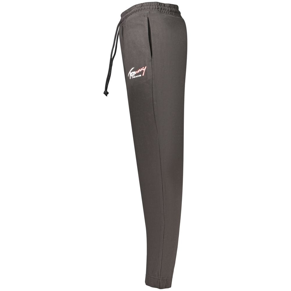 Pantalon homme Tommy Hilfiger en coton noir, style élégant, avec ceinture et poches visibles.