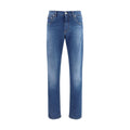 Jeans slim en coton bleu Dolce & Gabbana, ajustés, avec fermeture éclair et poches avant, vue de face.