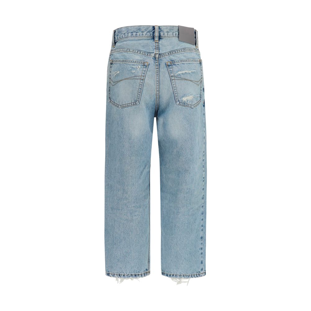 Jeans cropped en coton bleu de Balenciaga, coupe tendance, avec détails modernes visibles sur l'image.