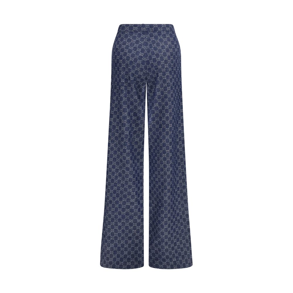 Pantalon casual en coton bleu Gucci pour homme, style détendu et confortable, avec une coupe moderne et logo Gucci visible.