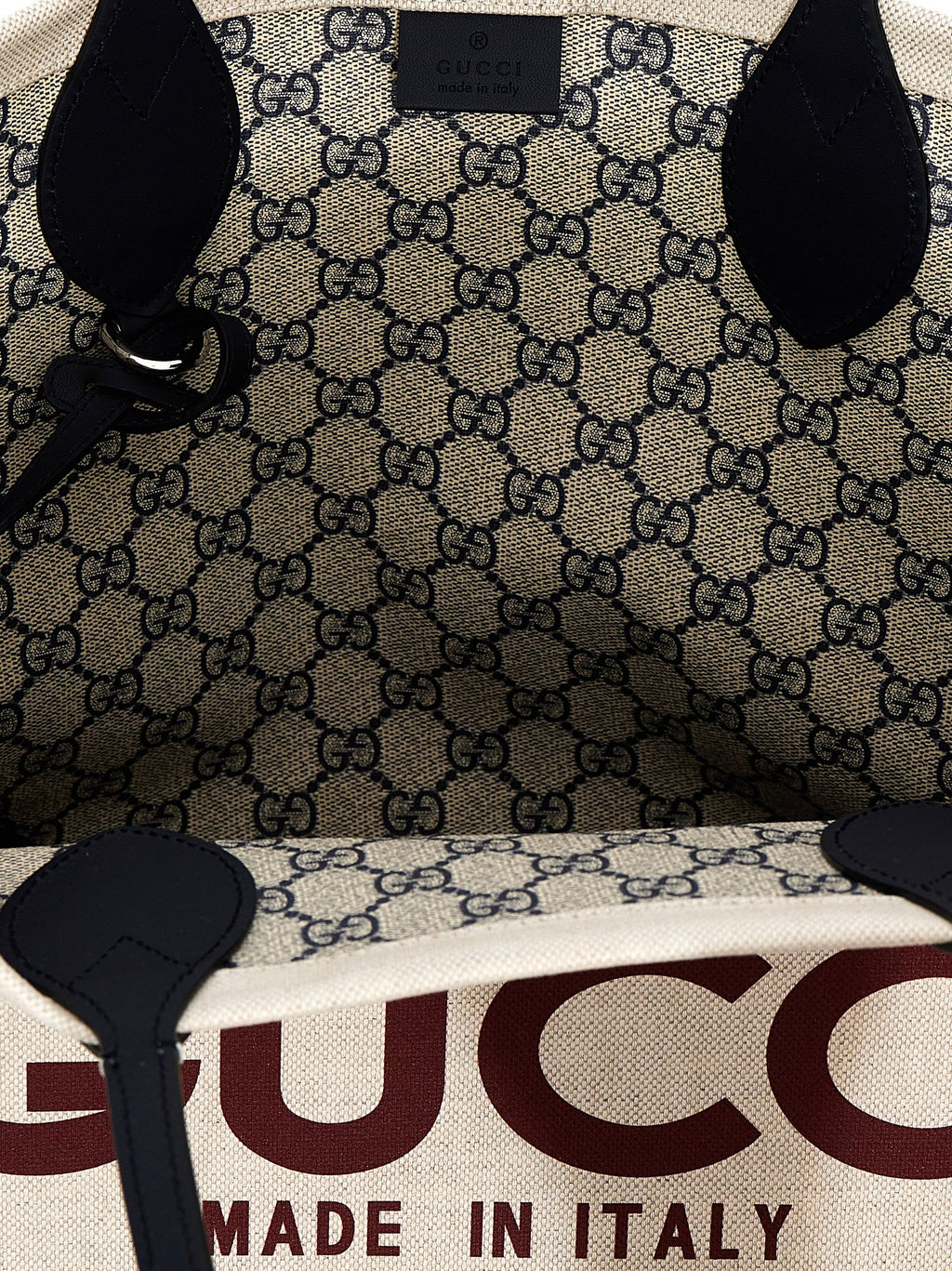 Sac cabas en polyéthylène beige Gucci avec logo discret, vue de face, pour un style élégant et pratique.