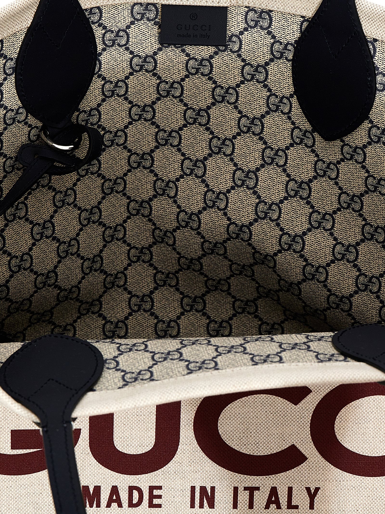 Sac cabas en polyéthylène beige Gucci avec logo discret, vue de face, pour un style élégant et pratique.