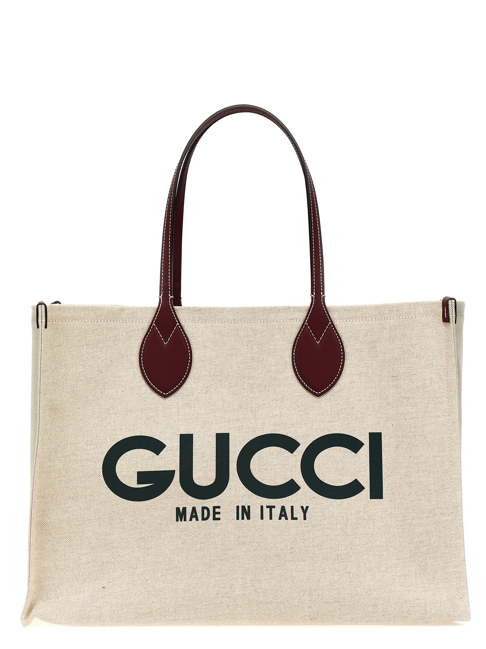 Sac Gucci beige en polyéthylène avec poignées, aperçu du sac cabas élégant et spacieux pour le quotidien.